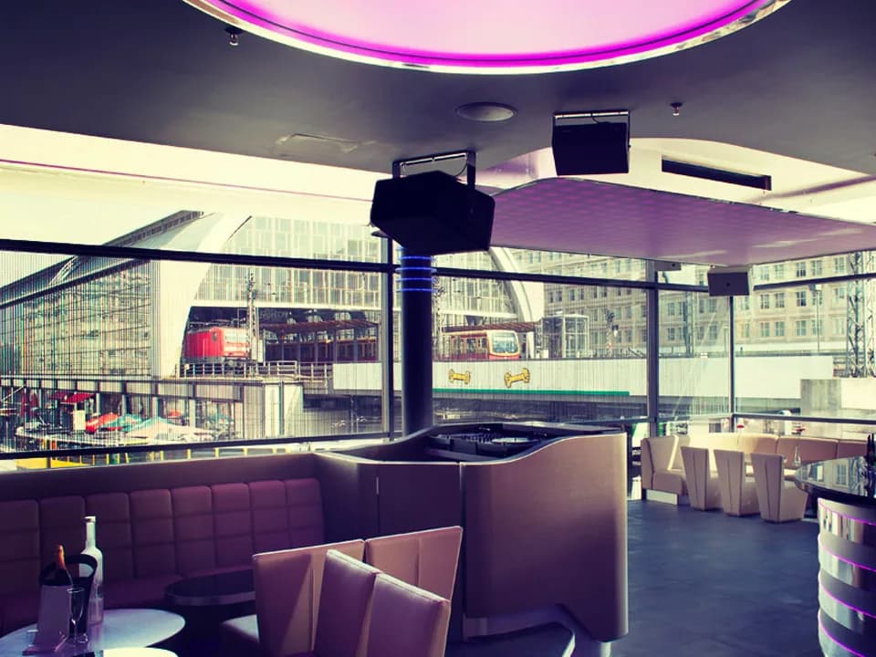 DJ booth and lounge in the Carambar club with a view of Alexanderplatz station